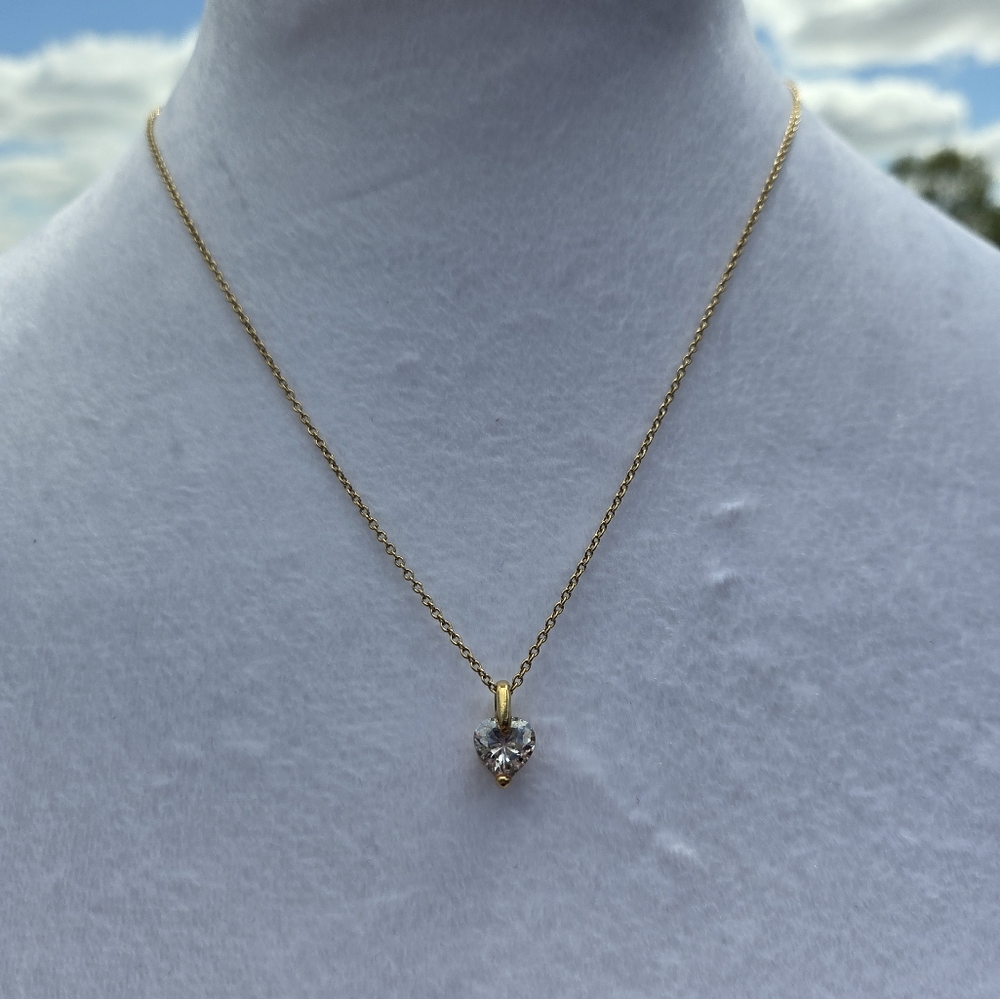 19. Elegant Gold Necklace with Silver Pendant